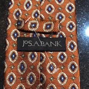 JoS A Bank tie. Rust and blue color